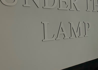 "Under The Lamp" sign on wall, Birmingham, England, GB venue.