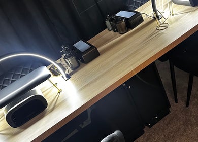 Elegant manicure station at Under The Lamp, Birmingham, England, GB, featuring modern lighting and tools.