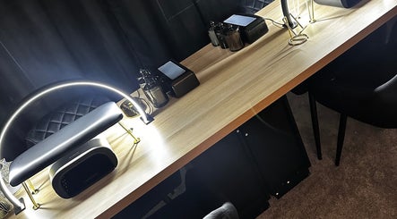 Elegant manicure station at Under The Lamp, Birmingham, England, GB, featuring modern lighting and tools.