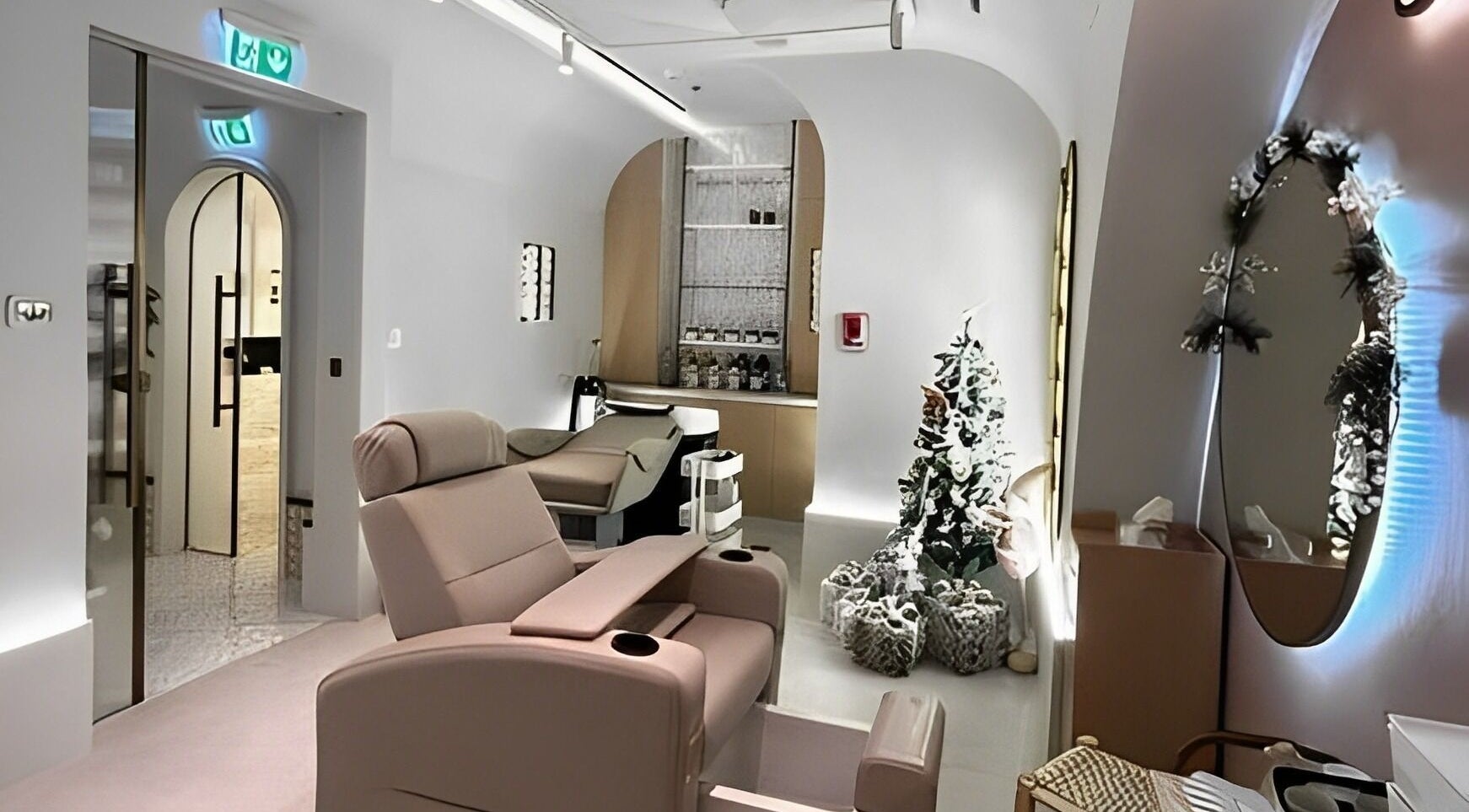 Relaxing treatment room at Sultana Spa LLC, Dubai, AE, featuring plush seating and chic decor.
