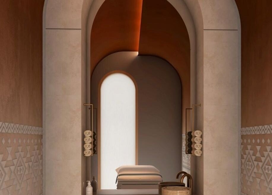 Elegant spa room at Sultana Spa LLC, Dubai, AE with soft lighting and decorative arches for relaxation.