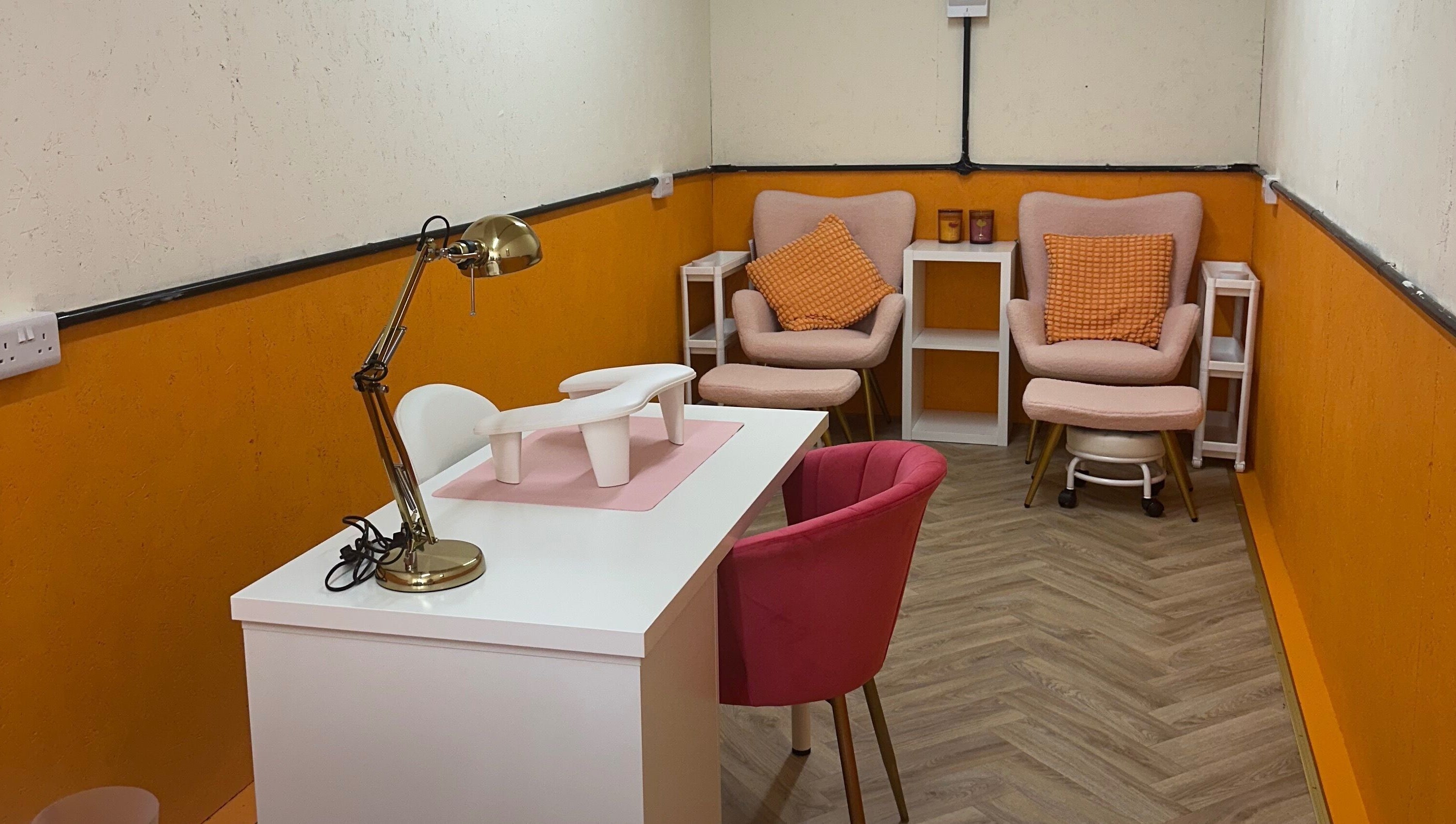 Chic manicuring space at So Gel Studio, Bristol, England, GB, featuring stylish chairs and a sleek table.