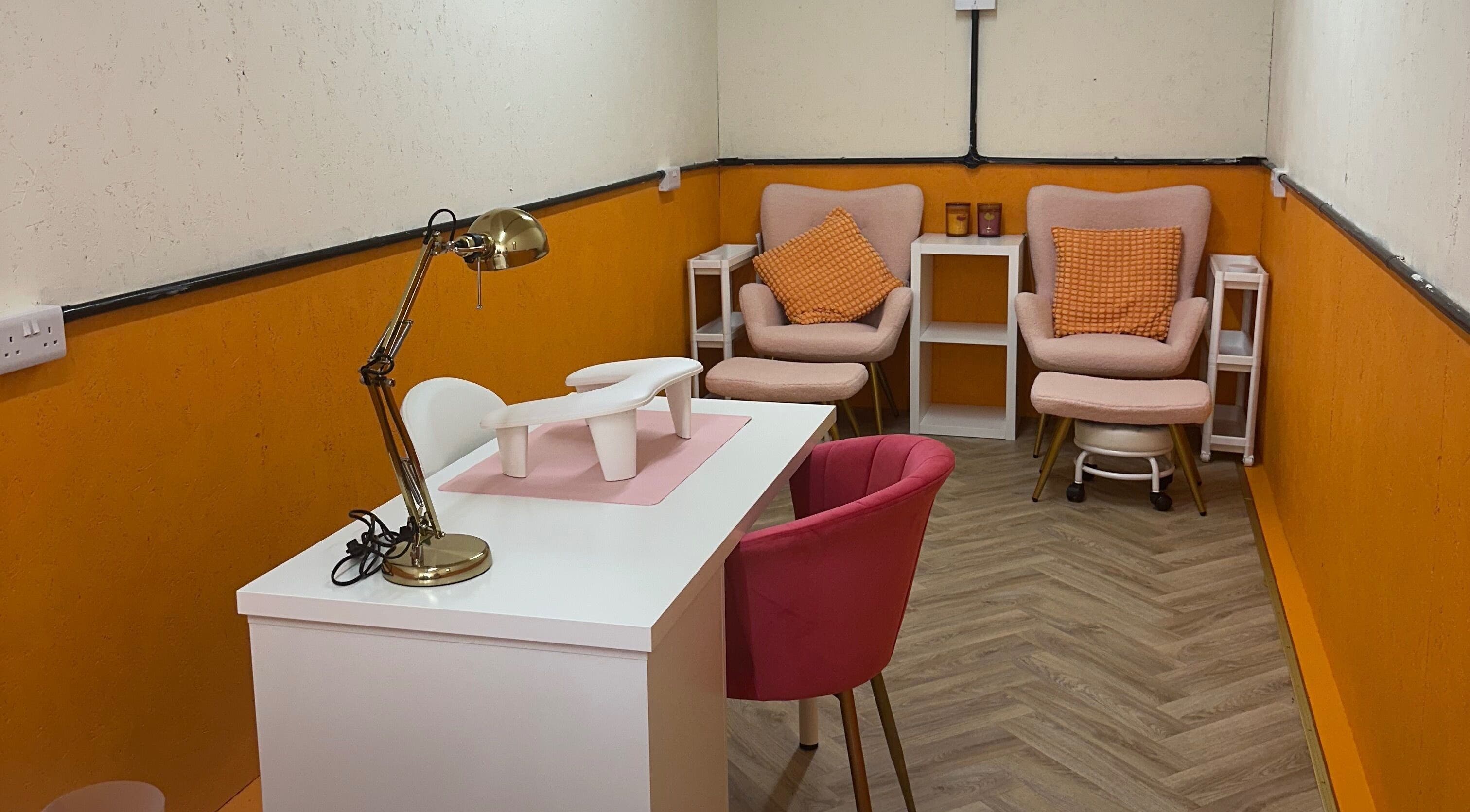 Chic manicuring space at So Gel Studio, Bristol, England, GB, featuring stylish chairs and a sleek table.