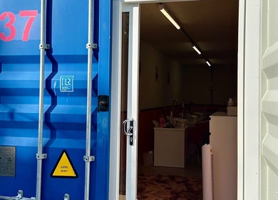 Entrance to So Gel Studio in Bristol, England, GB showing a well-lit interior through an open door.