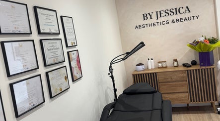 Interior of By Jessica Aesthetics and Beauty in Bishop Auckland, England, GB with certificates and a treatment bed.