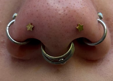 Nose piercings with star studs at Pin Cushion Piercing, Buckland, Waikato, NZ. Stylish and unique body art.