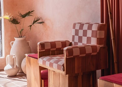 Elegant checkered chair at Rosie's Nail Bar, Badung, Indonesia, ID, highlighting cozy interior design.