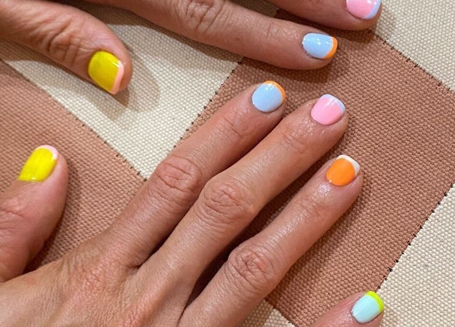 Colorful manicure at Rosie's Nail Bar - Canggu, Badung, Indonesia, ID. Showcasing bright, artistic nail designs.