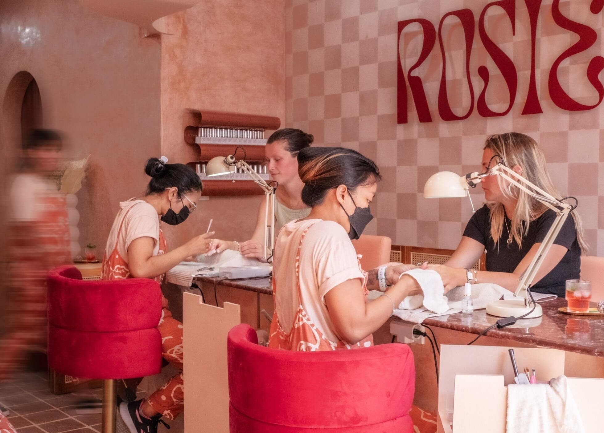 Clients enjoying manicures at Rosies Nail Bar - Nusa Lembongan, Bali, Bali, ID in a chic, relaxing setting.