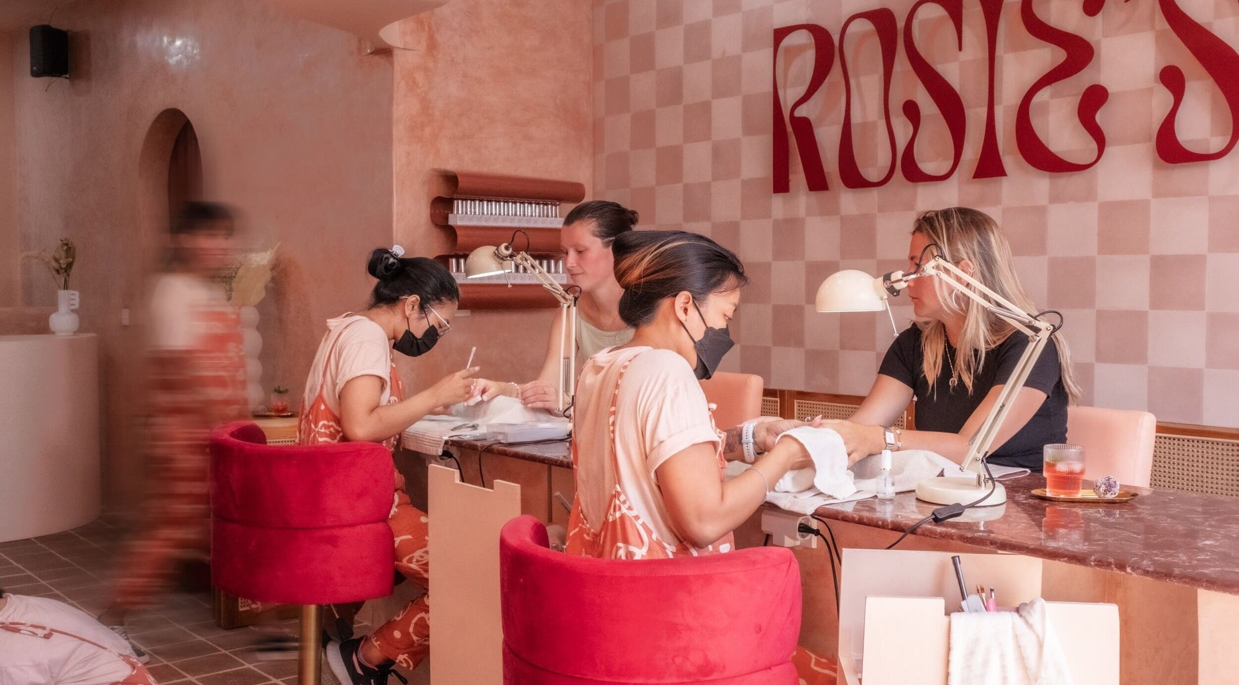 Clients enjoying manicures at Rosies Nail Bar - Nusa Lembongan, Bali, Bali, ID in a chic, relaxing setting.