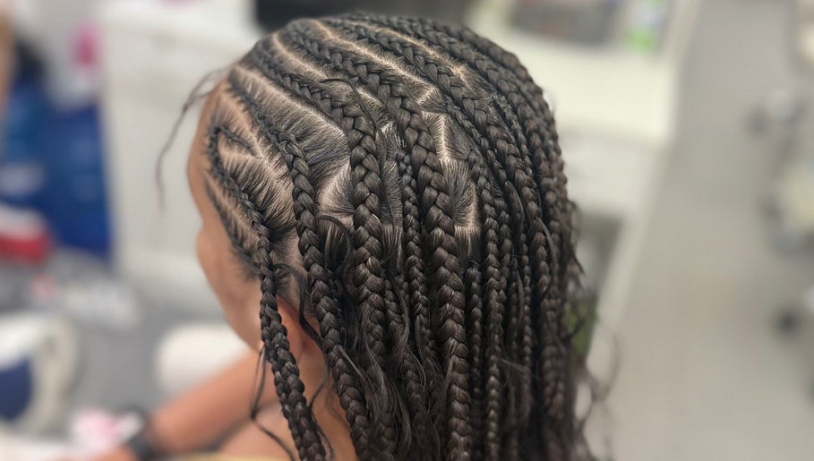 Intricate braiding style at Hair by Kiandra, Marigot, MF showcasing expert styling techniques.