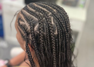 Intricate braiding style at Hair by Kiandra, Marigot, MF showcasing expert styling techniques.