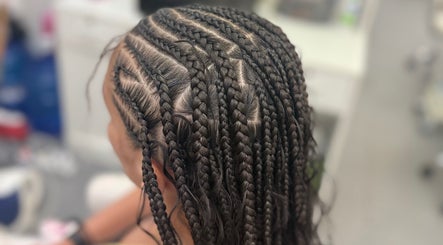 Intricate braiding style at Hair by Kiandra, Marigot, MF showcasing expert styling techniques.