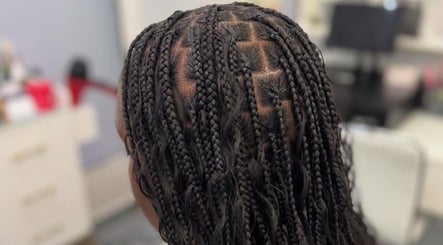 Intricate braided hairstyle at Hair by Kiandra, Marigot, MF showcasing professional salon craft.