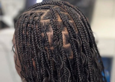 Intricate braided hairstyle at Hair by Kiandra in Marigot, MF, showcasing detailed craftsmanship.
