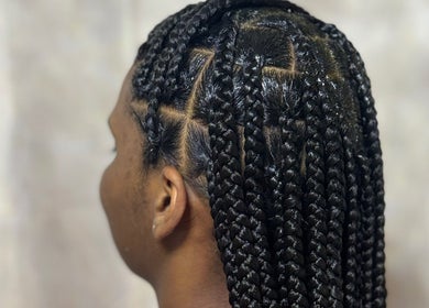 Detailed braided hairstyle at Hair by Kiandra in Marigot, MF showcasing expert styling.