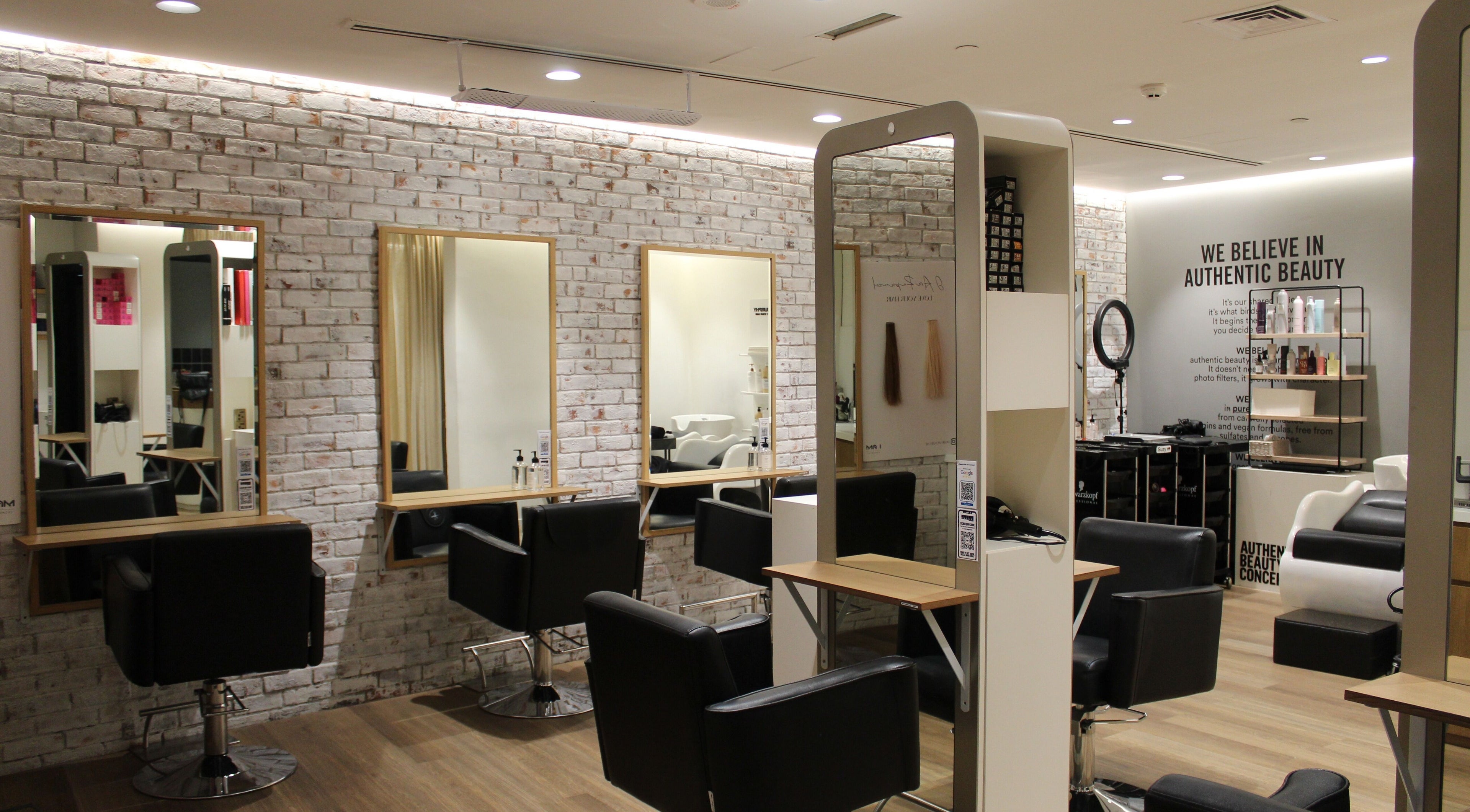 Stylish salon interior at Chill Serenity- Marina, Dubai, Dubai, AE featuring modern chairs and mirrors.