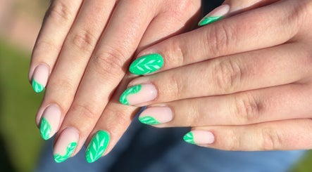 Green leaf nail art at The Glossy Palette, Cape Town, Western Cape, ZA, showcasing elegant manicure design.