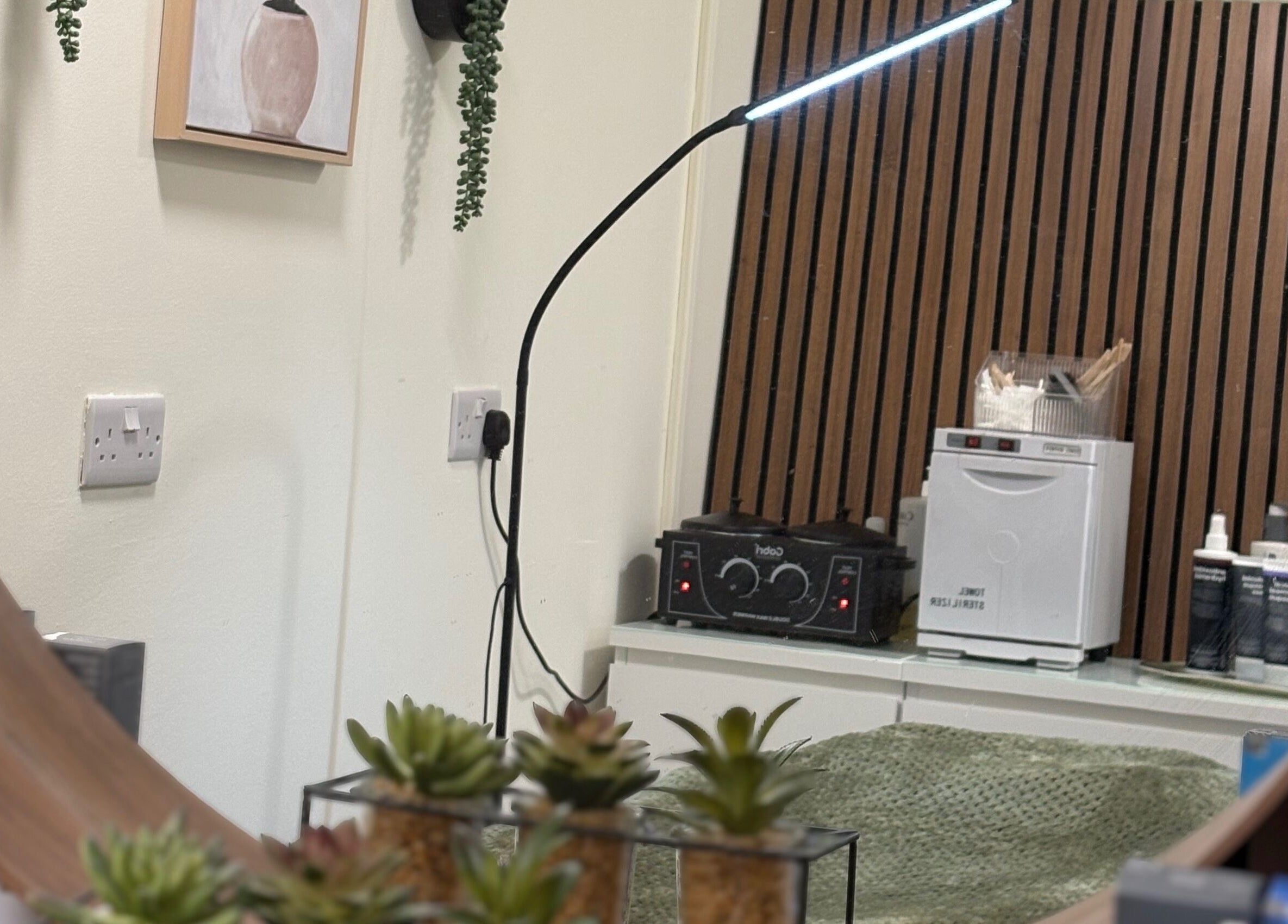 Interior of Sage Beauty By Charelle, Kilmacolm, Scotland, GB featuring a chic mirror and wooden decor.