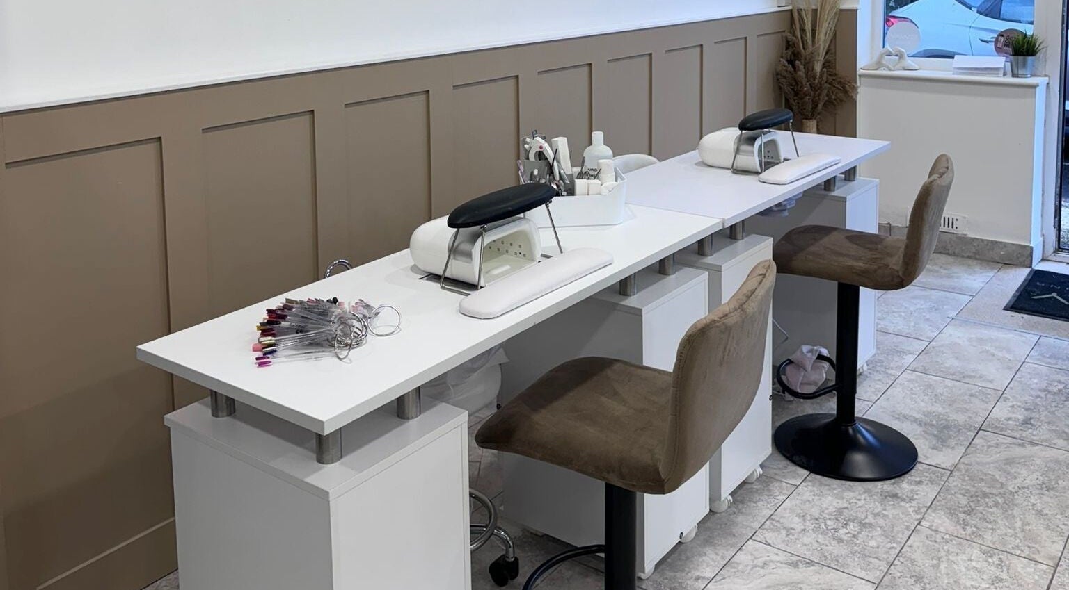Chic nail station at The Salon Costessey, Costessey, England, GB, featuring modern seating and tools.