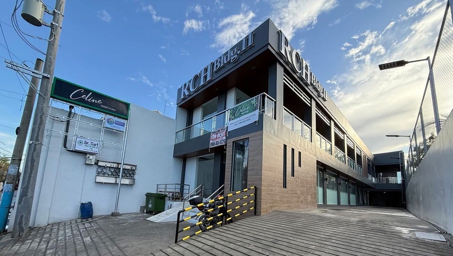 Modern exterior of RCH Bldg with clear signage, near Charmed Nails & Coffee Studio, Meycauayan, Central Luzon, PH.