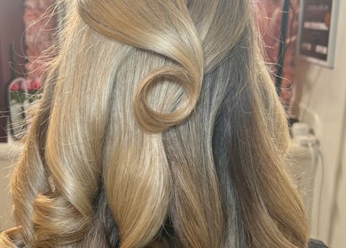 Stylish updo at Makeup by Elisha Simon, Northampton, England, GB showcasing vibrant blonde curls.
