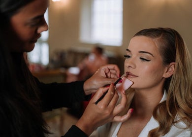 Makeup by Elisha Simon beautician applying lipstick in Northampton, England, GB.