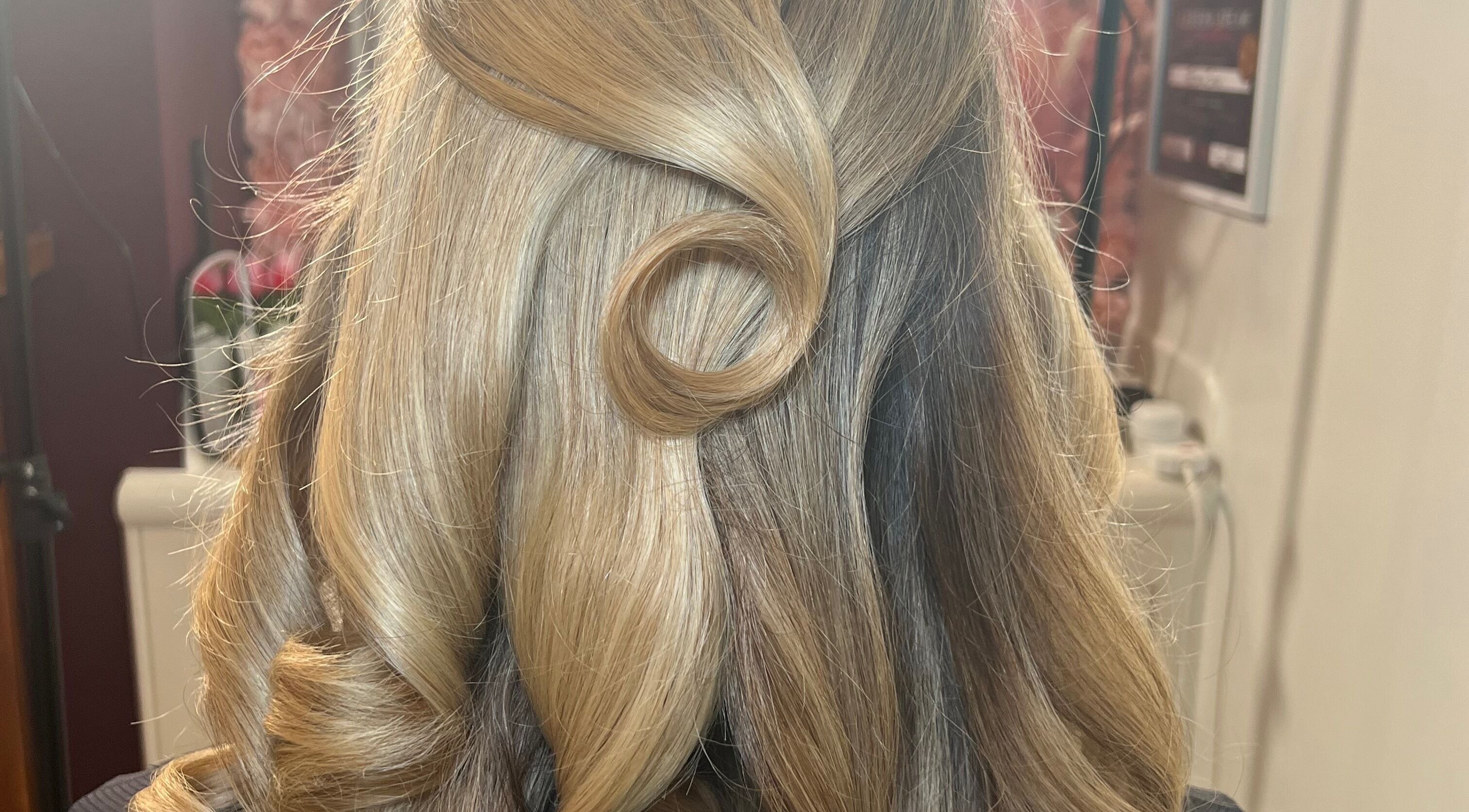 Sophisticated hairstyle at Makeup by Elisha Simon, Northampton, England, GB showcasing intricate curls.