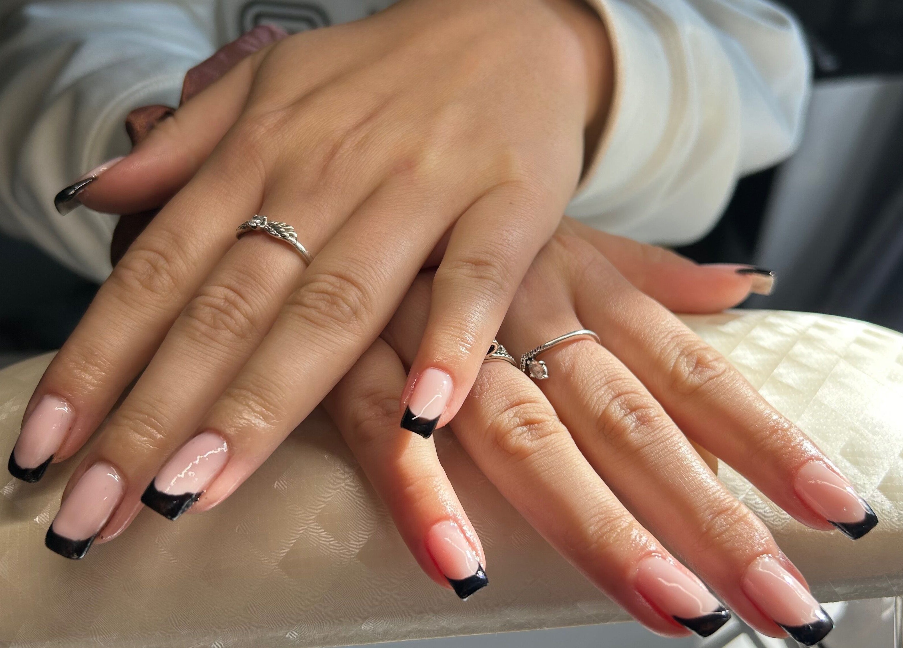 Chic black-tipped nails at B's Nails salon in Gosport, England, GB, showcasing refined style and elegance.