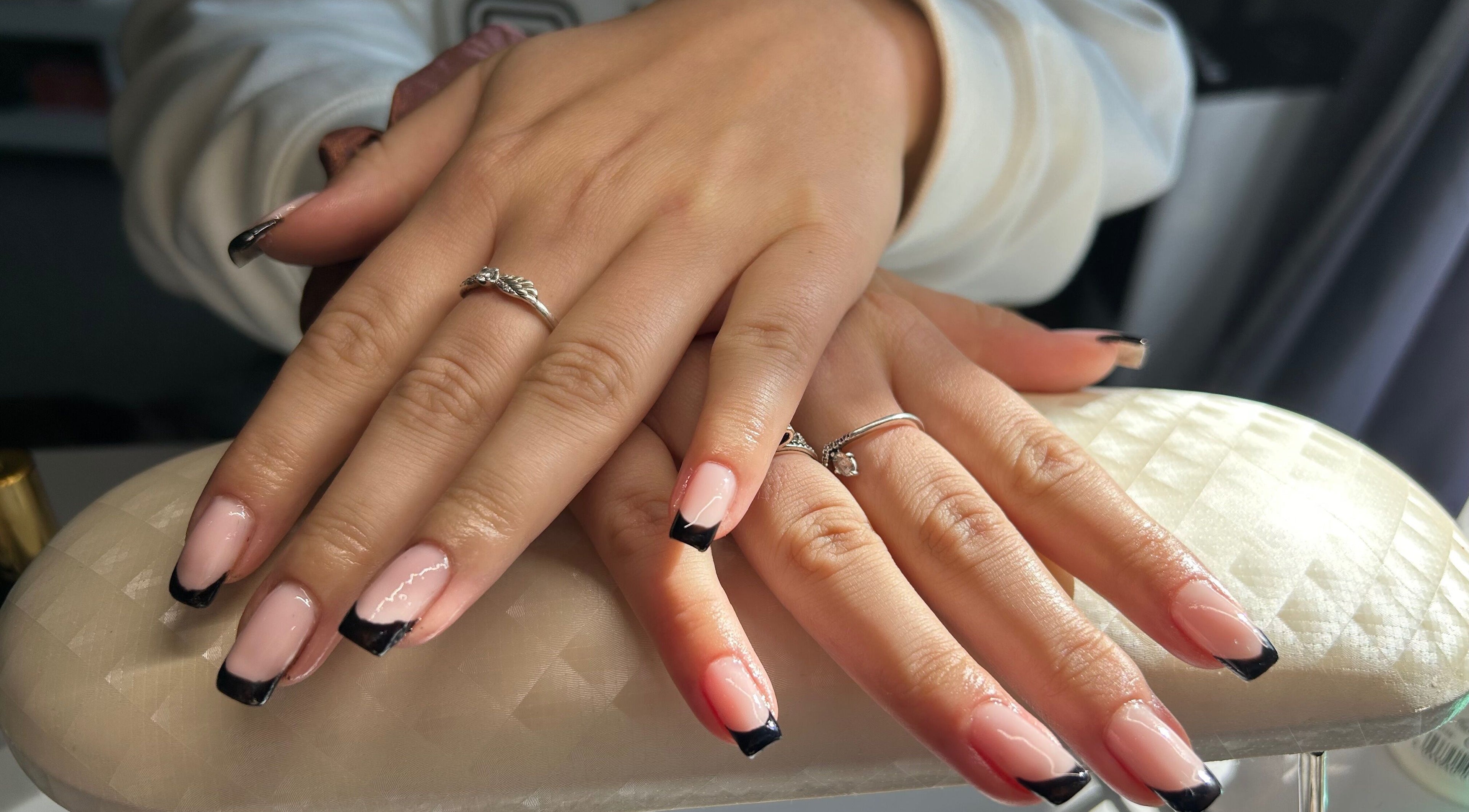 Chic black-tipped nails at B's Nails salon in Gosport, England, GB, showcasing refined style and elegance.