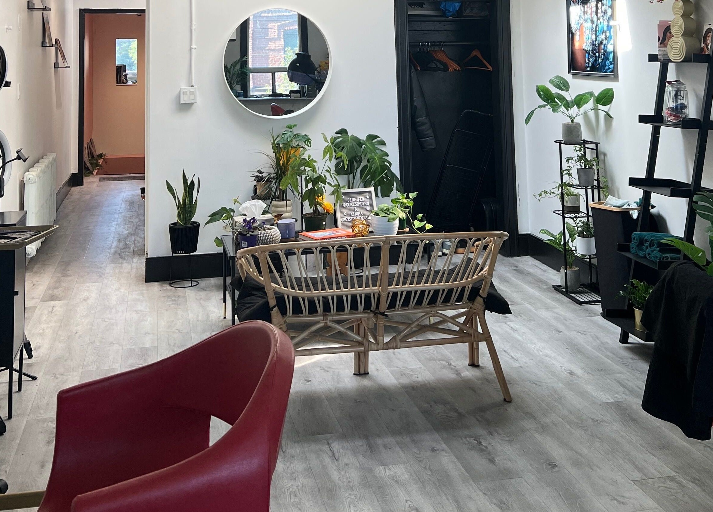 Modern beauty studio in Curls by Jenn, Toronto, Ontario, CA, with sleek decor and vibrant plants.