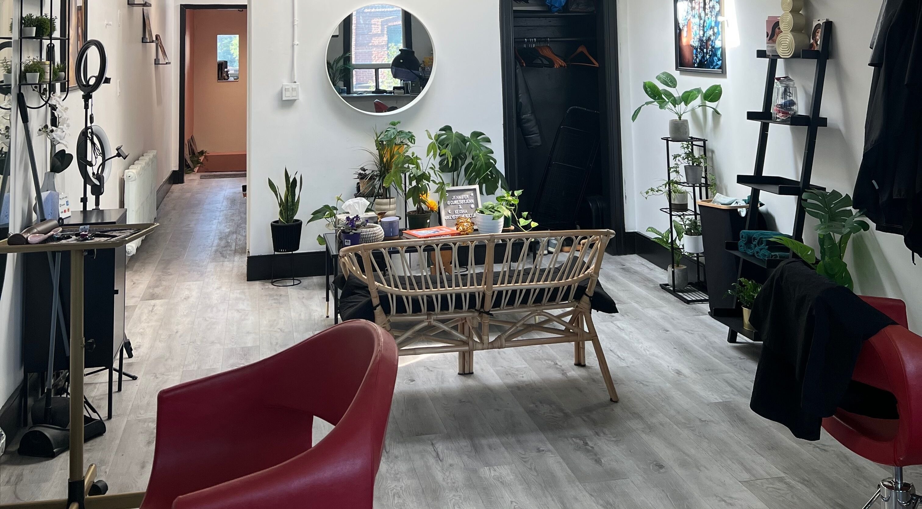 Modern beauty studio in Curls by Jenn, Toronto, Ontario, CA, with sleek decor and vibrant plants.