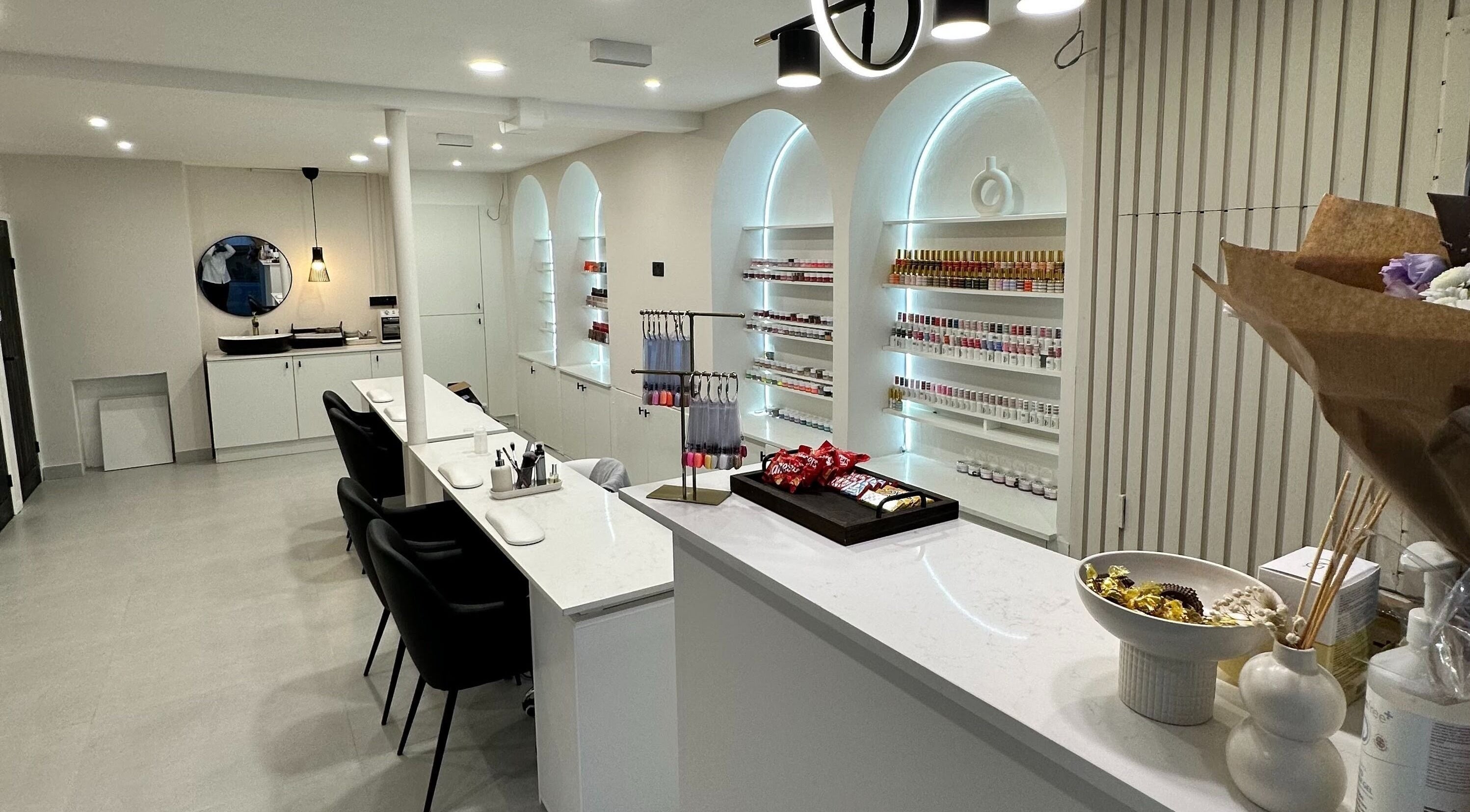 Sleek interior of The Nail Maison, Biggin Hill, England, GB with elegant nail polish display.