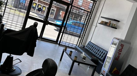 Modern interior of FadeCentral Barbershop, Enfield, New South Wales, AU, featuring a sleek waiting area.