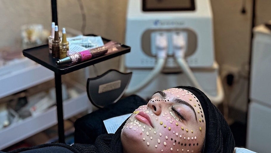 Client receiving facial treatment at Dermal Glowz, Punchbowl, New South Wales, AU with skincare equipment.