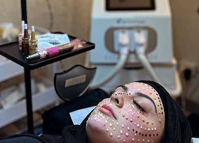 Client receiving facial treatment at Dermal Glowz, Punchbowl, New South Wales, AU with skincare equipment.