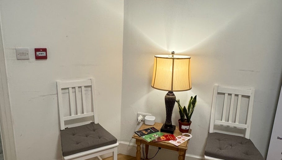 Warm waiting area with chairs and lamp at Larissa Albernaz, Gort, County Galway, IE.