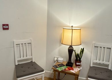 Warm waiting area with chairs and lamp at Larissa Albernaz, Gort, County Galway, IE.