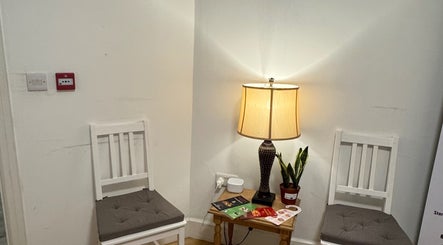 Warm waiting area with chairs and lamp at Larissa Albernaz, Gort, County Galway, IE.