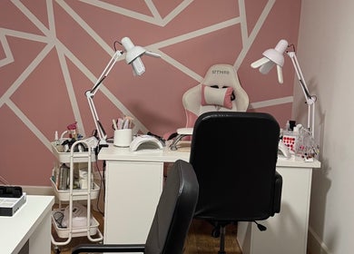 Stylish nail salon interior at Larissa Albernaz, Gort, County Galway, IE with pink geometric walls and modern furniture.