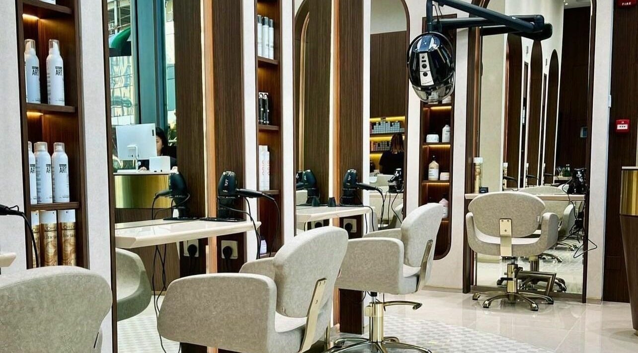 Interior view of Avel Beauty Salon - Aykon City, Dubai, featuring elegant styling chairs and mirrors.