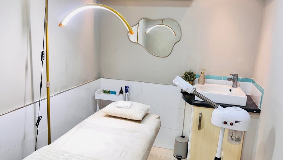 Serene treatment room at MamiYaba Salon, London, England, GB, featuring a massage table and modern amenities.