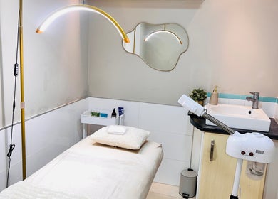 Serene treatment room at MamiYaba Salon, London, England, GB, featuring a massage table and modern amenities.