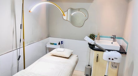 Serene treatment room at MamiYaba Salon, London, England, GB, featuring a massage table and modern amenities.