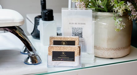 Stylish salon setting with cards and decor at MamiYaba Salon, London, England, GB.
