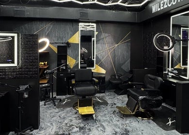 Stylish interior of Milez Cutz in Nassau, New Providence, BS, featuring modern design with sleek black barber chairs.