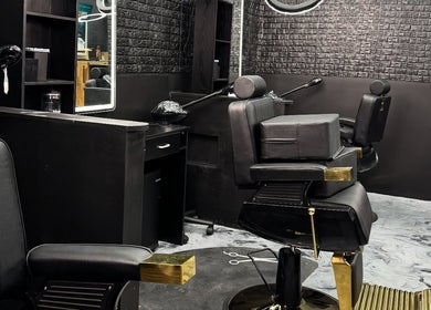 Elegant modern barber chair at Milez Cutz, Nassau, New Providence, BS, showcasing sleek interior design.