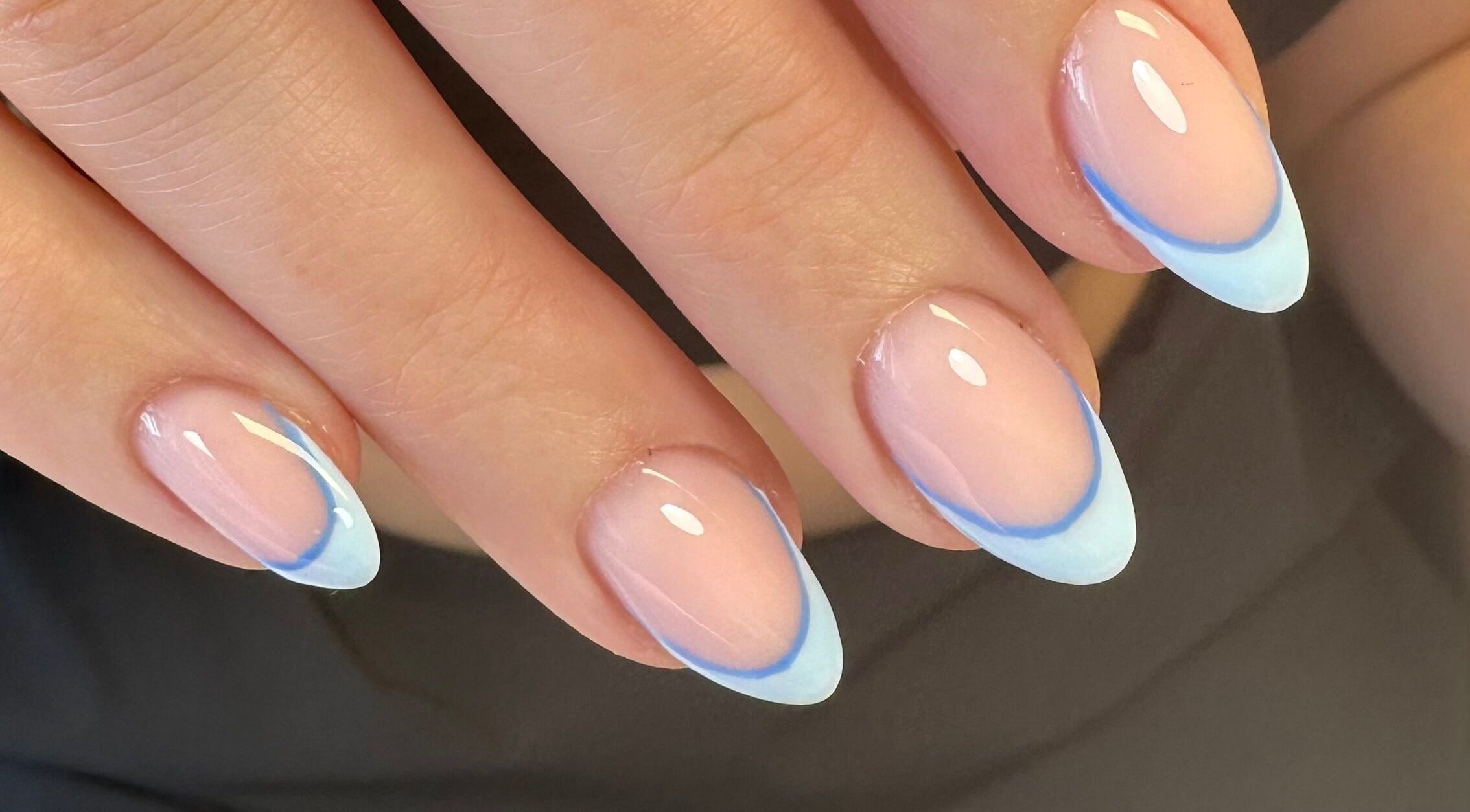 Elegant blue-accented nails at The Quiet Space, Thorold, Ontario, CA. Showcase of fine manicure style.
