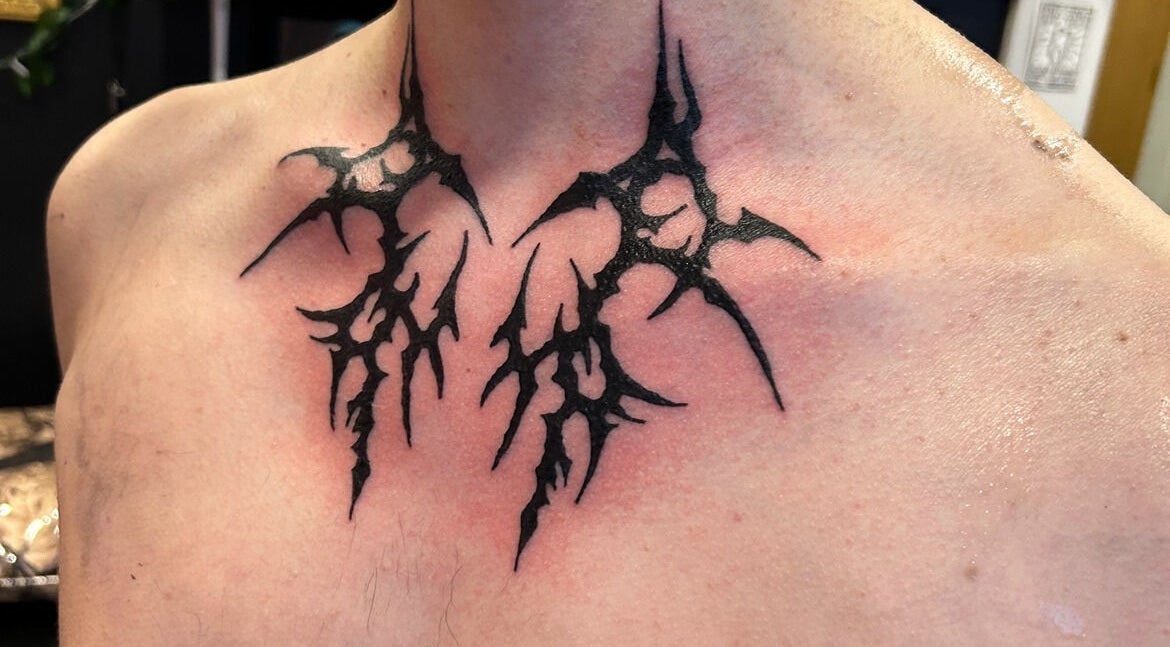 Unique neck tattoo at Dark Dimension Tattoo in Calgary, Alberta, CA. Intricate black line design.