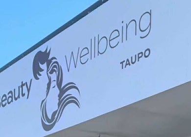 Sleek Brows & CornBraids signage at Taupō, Waikato, NZ showcasing beauty and wellness services.